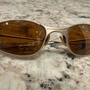 Oakley Sunglasses with Silver Frame and Brown Lenses